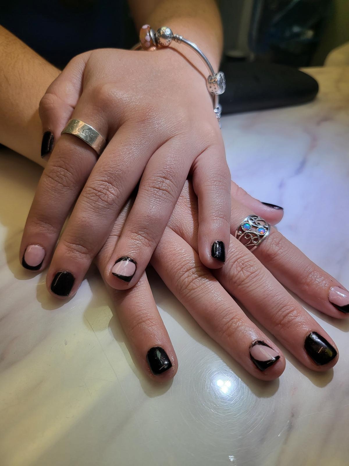 Modern black acrylic with negative-space half-moon design — Allegro Nail Parlour