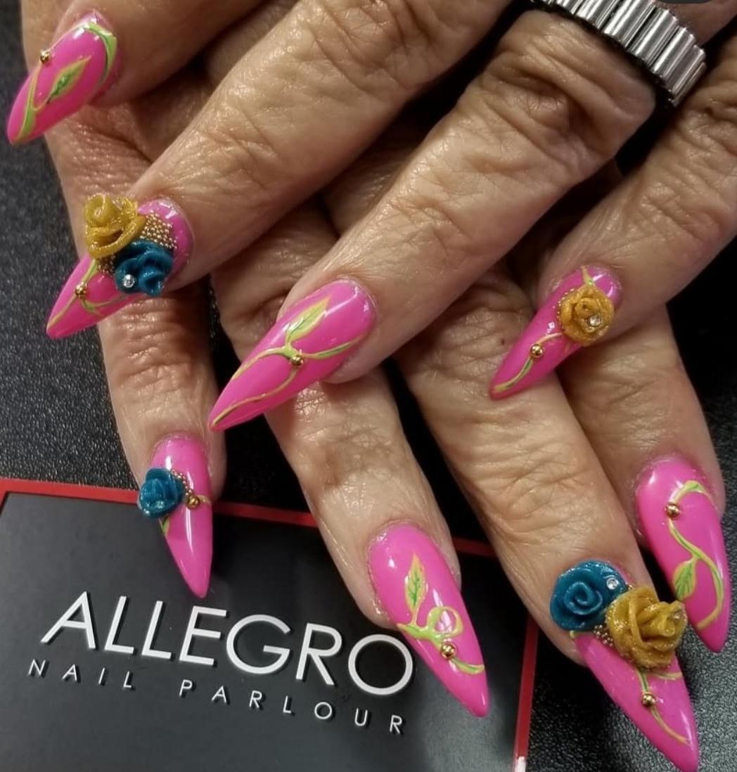 Signature pink stiletto nail set with 3D rose accents — Allegro El Paso