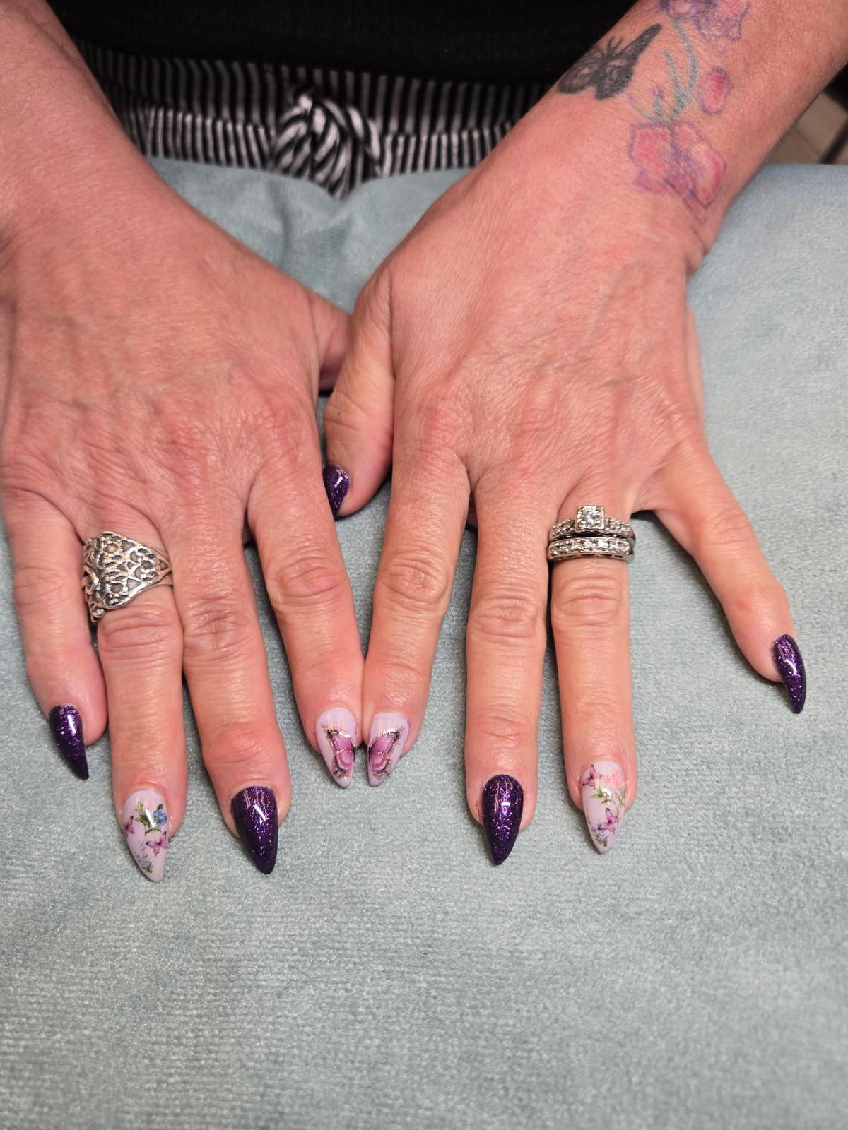 Hot pink short nails with cow-print accent at Allegro Nail Parlour